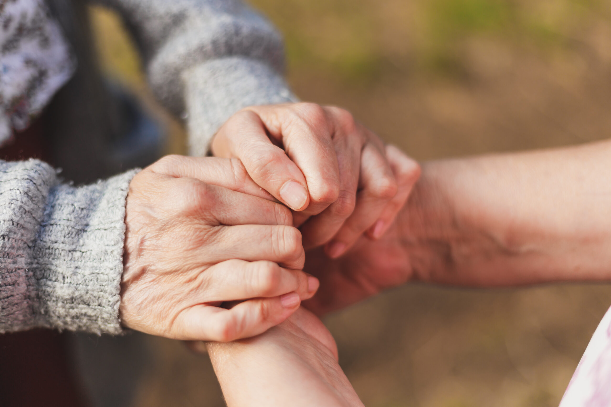 Assisted Living Locators: Elder hands held